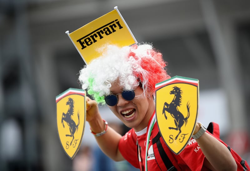 A Ferrari fan shows his support during previews ahead of the Formula One Grand Prix of Japan at Suzuka Circuit. Clive Mason / Getty Images.