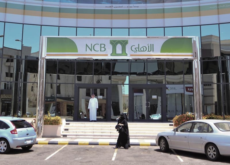 A branch of Saudi Arabia's National Commercial Bank. The kingdom's central bank instructed all non-essential bank staff to work from home for 16 days in a measure aimed at restricting the spread of the coronavirus. Michael Bou-Nacklie / The National