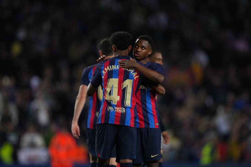 Ansu Fati and Lamine Yamal embrace following Barcelona's win over Real Bets. Getty