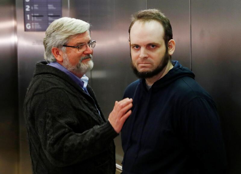 Joshua Boyle stands next to his father Patrick Doyle after arriving with his wife and three children at Toronto Pearson International Airport, nearly 5 years after he and his wife were abducted in Afghanistan in 2012 by the Taliban-allied Haqqani network, in Toronto, Ontario, Canada, October 13, 2017.    REUTERS/Mark Blinch