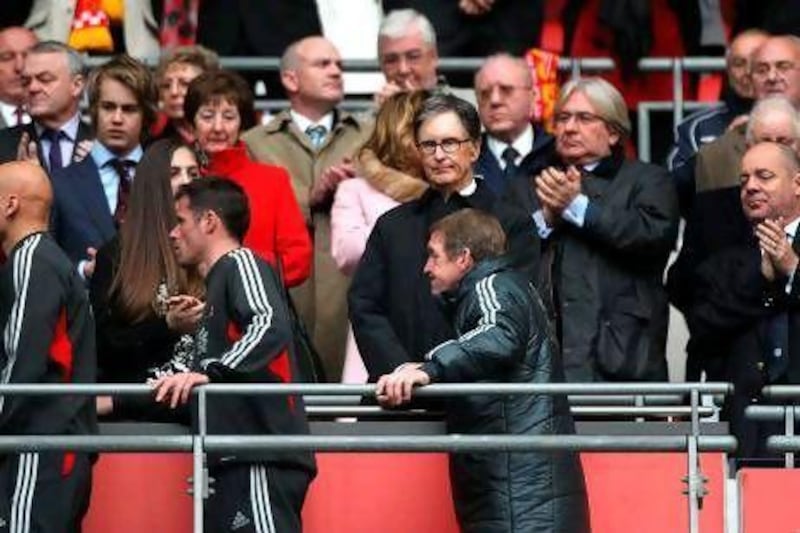 Liverpool owner John W Henry, centre top, fired Kenny Dalglish, centre bottom, after the club's poor league results. Nick Potts / PA