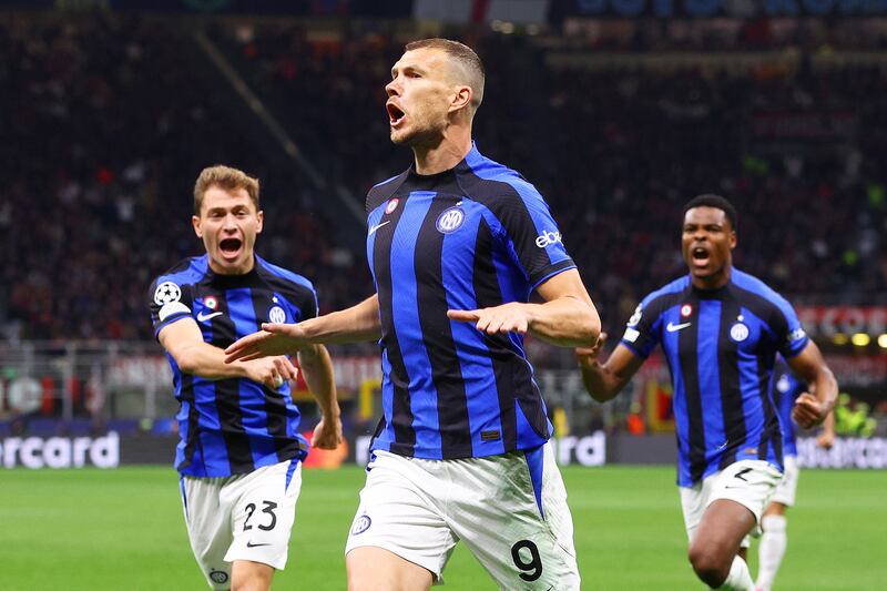 Edin Dzeko of Inter Milan celebrates with teammates after scoring the team's opening goal in the Champions League semi-final first-leg match against AC Milan at San Siro on May 10, 2023. Getty