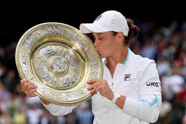 FILE PHOTO: Tennis - Wimbledon - All England Lawn Tennis and Croquet Club, London, Britain - July 10, 2021  Australia's Ashleigh Barty holds the trophy after winning her final match against Czech Republic's Karolina Pliskova REUTERS / Toby Melville / File Photo