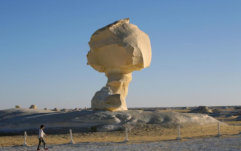 Tourists visit the mushroom, a massive white inselberg that is characteristic of Egypt's White Desert. EPA