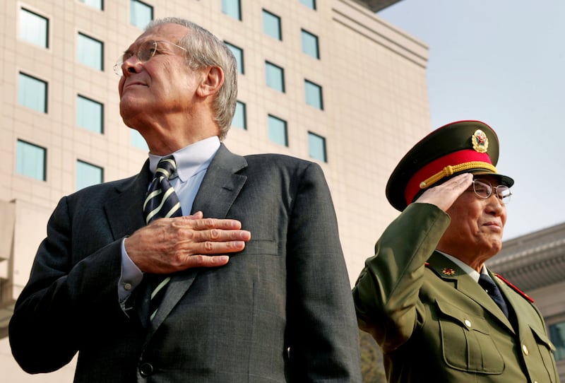 Donald Rumsfeld and Cao Gangchuan, China's defence minister, attend a ceremony in Beijing in October 2005. Reuters