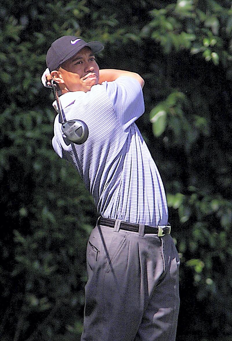 Tiger Woods of the US watches his tee shot 02 April 2001, during his practice round for the 2001 Masters at the Augusta National Golf Club in Augusta, Georgia. The Masters will begin 05 April.  AFP PHOTO/Timothy A. CLARY/rs (Photo by TIMOTHY A. CLARY / AFP)