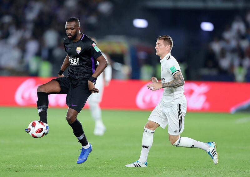 Abu Dhabi, United Arab Emirates - December 22, 2018: Toni Kroos of Real Madrid competes with Tongo Doumbia of Al Ain during the match between Real Madrid and Al Ain at the Fifa Club World Cup final. Saturday the 22nd of December 2018 at the Zayed Sports City Stadium, Abu Dhabi. Chris Whiteoak / The National