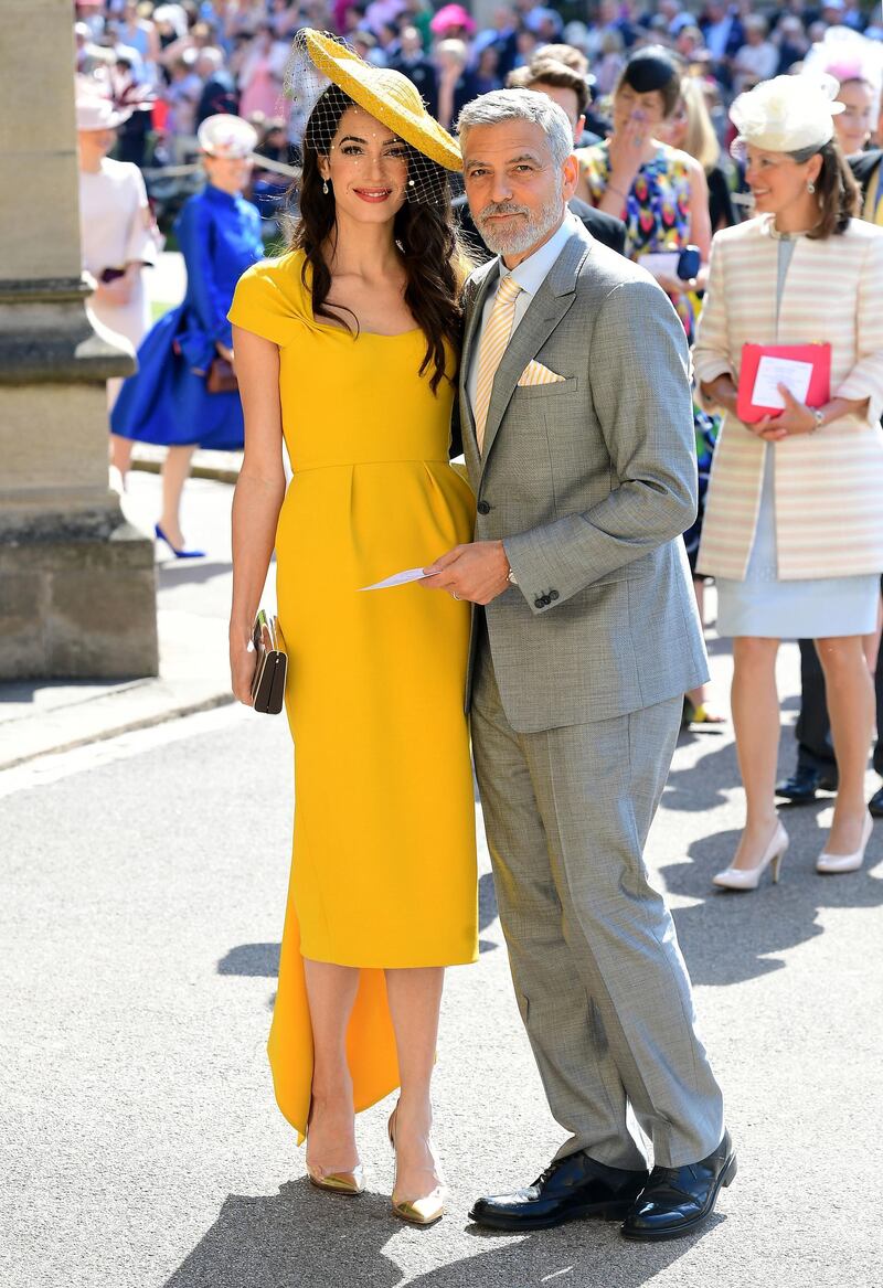 WINDSOR, UNITED KINGDOM - MAY 19:  Amal and George Clooney arrive at St George's Chapel at Windsor Castle before the wedding of Prince Harry to Meghan Markle on May 19, 2018 in Windsor, England. (Photo by Ian West - WPA Pool/Getty Images)