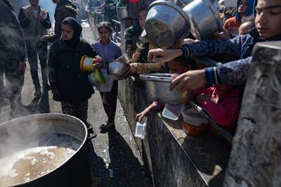 Displaced Palestinians at Rafah refugee camp in the southern Gaza Strip on Thursday. EPA