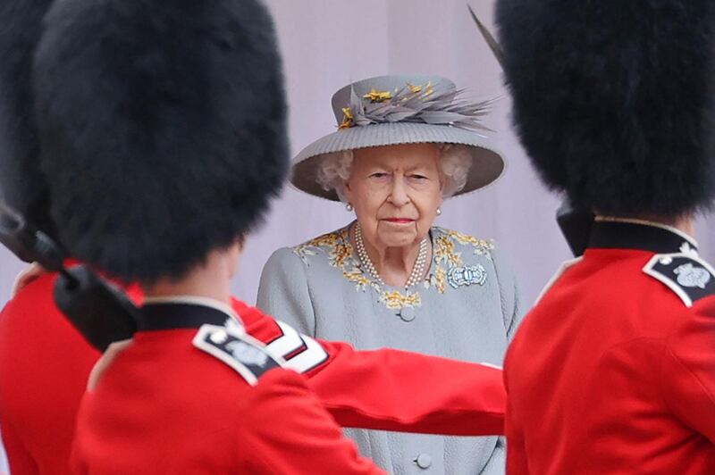 Queen Elizabeth II watches a military ceremony to mark her official birthday at Windsor Castle on June 12, 2021. AFP
