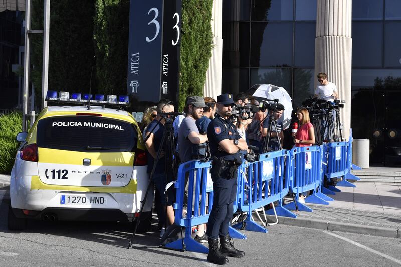 Police and media stand waiting for the arrival of Real Madrid's Portuguese forward Cristiano Ronaldo to appear at a court in Pozuelo de Alarcon. Gerard Julien / AFP
