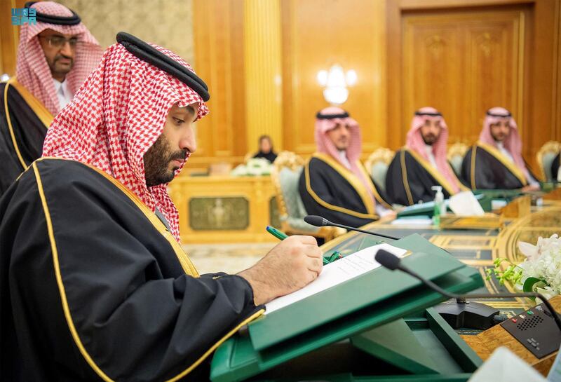 Saudi Crown Prince Mohammed bin Salman signs the budget during a ministerial council meeting in Riyadh on Wednesday. AFP