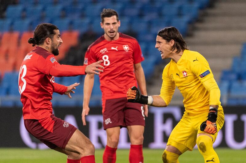 Switzerland's goalkeeper Yann Sommer (yellow) celebrates after saving two penalties. AP