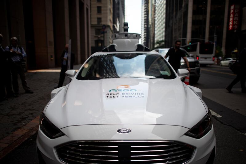 An Argo Ai self driving test vehicle, from the Pittsburgh-based autonomous vehicle startup is parked outside a a joint press conference of Ford and Volkswagen on July 12, 2019 in New York City. (Photo by Johannes EISELE / AFP)