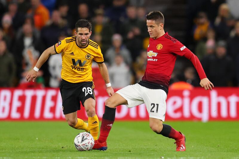 WOLVERHAMPTON, ENGLAND - MARCH 16: Joao Moutinho of Wolverhampton Wanderers challenges for the ball with Ander Herrera of Manchester United during the FA Cup Quarter Final match between Wolverhampton Wanderers and Manchester United at Molineux on March 16, 2019 in Wolverhampton, England. (Photo by Catherine Ivill/Getty Images)