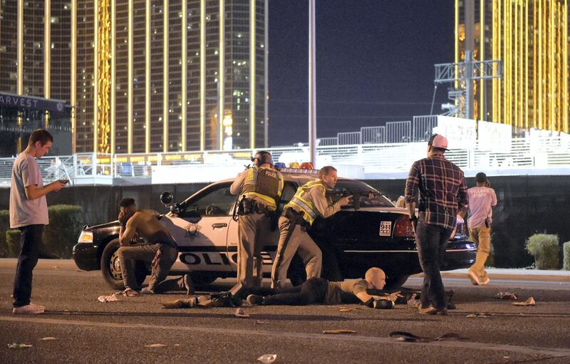 LAS VEGAS, NV - OCTOBER 01:   Las Vegas police stand guard along the streets outside the the Route 91 Harvest country music festival grounds after a active shooter was reported on October 1, 2017 in Las Vegas, Nevada. There are reports of an active shooter around the Mandalay Bay Resort and Casino.  (Photo by David Becker/Getty Images)