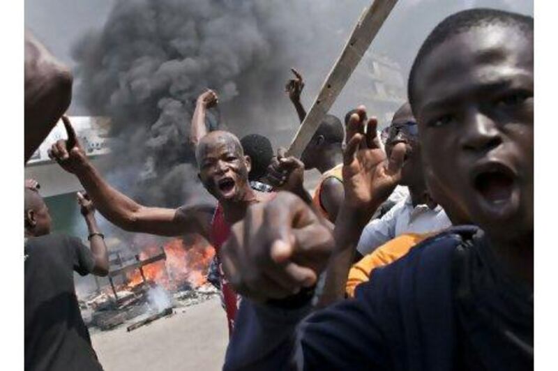 The political stand-off in the Ivory Coast has led to violent street protests. One reader blames the United States and France for backing one presidential contender in the interest of gaining economic concessions. Thibault Camus / AP