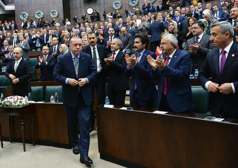 epaselect epa07112775 Turkish President Recep Tayyip Erdogan (C) prepares to address the parliament in Ankara, Turkey 23 October 2018. Erdogan is expected to address the parliament on the case of Saudi journalist Jamaal Khashoggi. Saudi Arabian official media on 19 October reported that journalists Jamal Khashoggi died as a result of a physical altercation inside the kingdom's consulate in Istanbul, where he was last seen entering on 02 October for routine paperwork.  EPA/STR