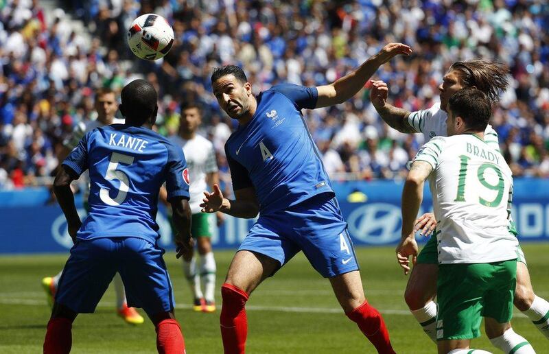 France defender Adil Rami in action with Republic of Ireland’s Jeff Hendrick and Robbie Brady. Kai Pfaffenbach / Reuters