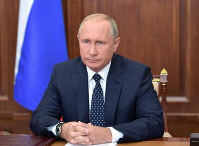 Russian President Vladimir Putin makes an address on the state TV in the Kremlin in Moscow, Russia, Wednesday, Aug. 29, 2018. Putin in a televised address Wednesday said without raising the retirement age Russia's pension system "would crack and eventually collapse." He offered concessions to the reform, saying that women's retirement age should increase from 55 to 60 years, lower than had proposed. (Alexei Druzhinin, Sputnik, Kremlin Pool Photo via AP)