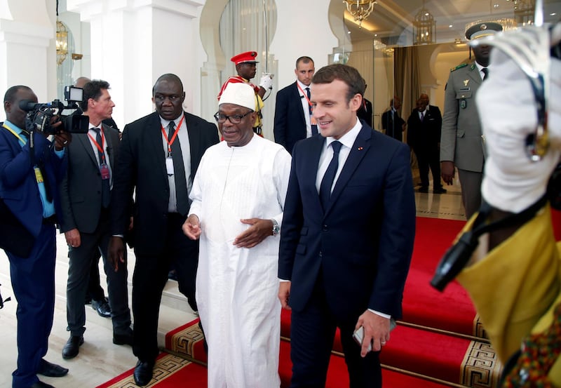 FILE PHOTO: Mali's President Ibrahim Boubacar Keita walks with French President Emmanuel Macron during G5 Sahel summit at the Koulouba presidential palace in Bamako, Mali, July 2, 2017. REUTERS/Luc Gnago/File Photo