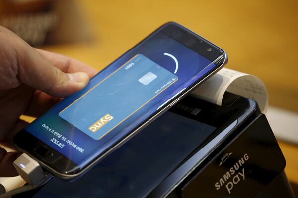 The adoption of contactless payments reduces the need for physical exchanges of money. Reuters