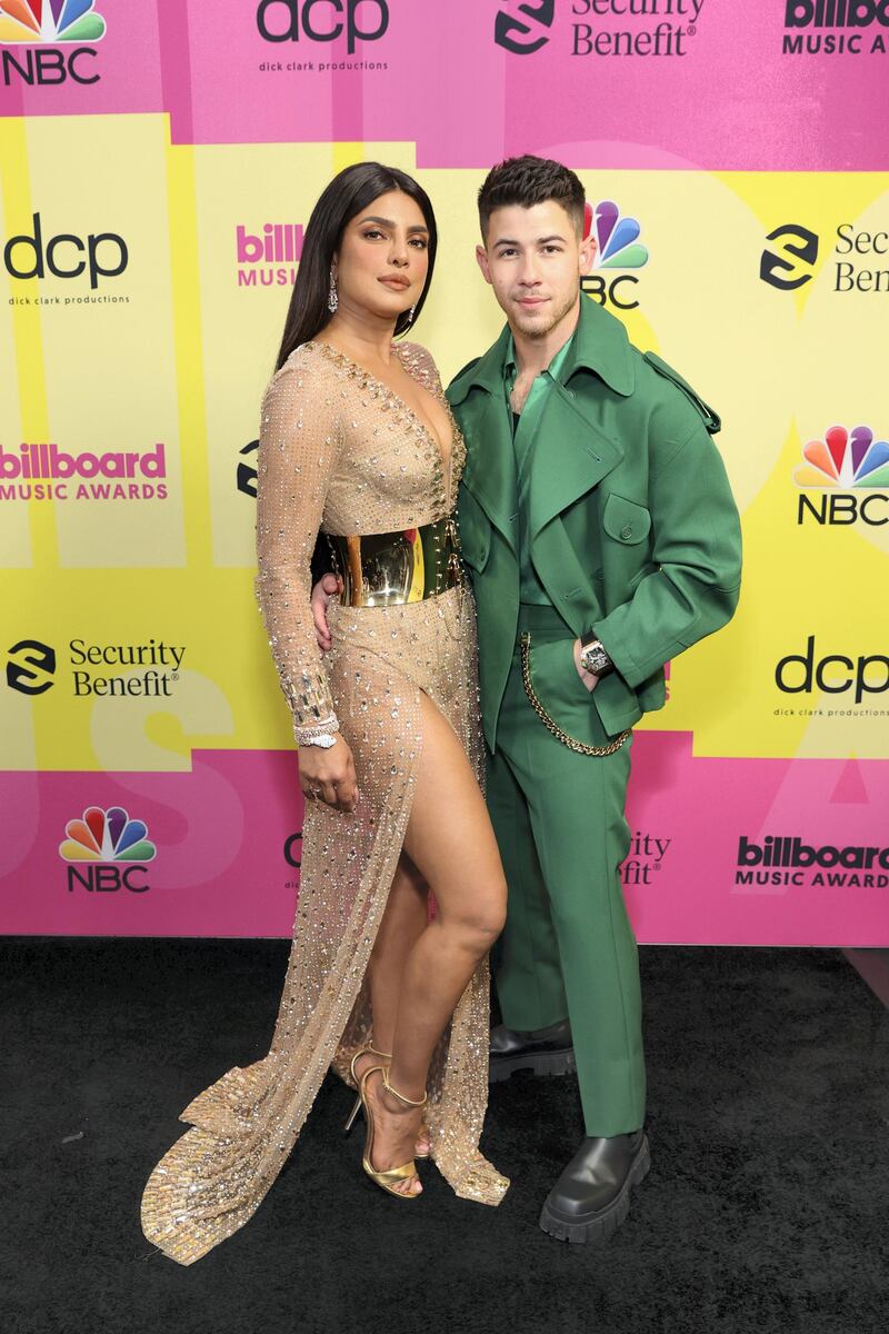 LOS ANGELES, CALIFORNIA - MAY 23: (L-R) Priyanka Chopra Jonas and Nick Jonas pose backstage for the 2021 Billboard Music Awards, broadcast on May 23, 2021 at Microsoft Theater in Los Angeles, California. (Photo by Rich Fury/Getty Images for dcp)