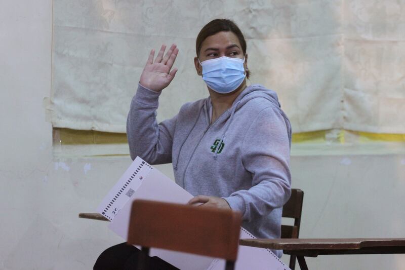 Vice presidential candidate, Davao City mayor Sara Duterte, running mate of Ferdinand Marcos Jr,  waves as she votes at a polling centre in Davao City. AP
