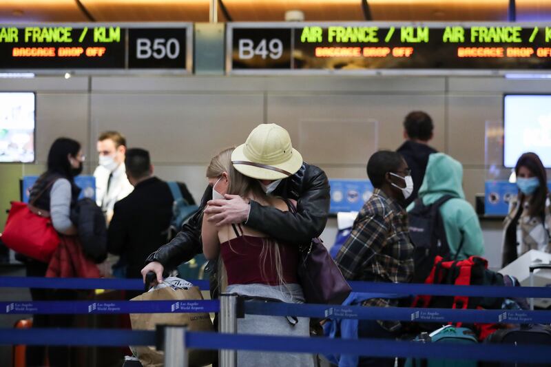 People wait in the check-in queue for Air France/KLM at Tom Bradley International Terminal at Los Angeles International Airport. EPA