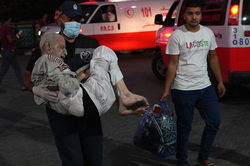 Palestinians wounded in the bombardment of Gaza are taken to Al Asa Hospital in Deir Al Balah. AP
