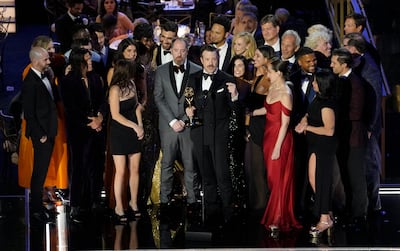 Jason Sudeikis, centre, and the cast and crew of 'Ted Lasso' accept the Emmy for outstanding comedy series. AP Photo 