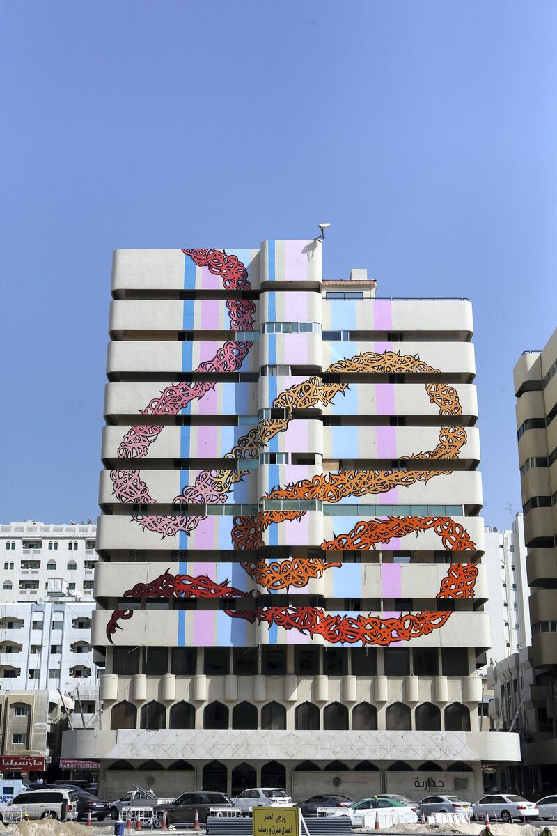 SHARJAH, UAE. February 15, 2015 -   Street artist eL Seed painted an abandoned building on Bank Street as part of the new initiative by the Sharjah government to bring art into public places, February 15, 2015. (Photos by: Sarah Dea/The National, Story by: Anna Seaman, Arts and Life)
 *** Local Caption ***  SDEA150215-elseed04.JPG