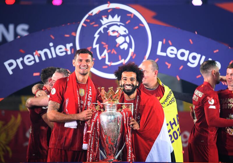 Liverpool's Dejan Lovren (left) and Mohamed Salah celebrate with the Premier League trophy. PA