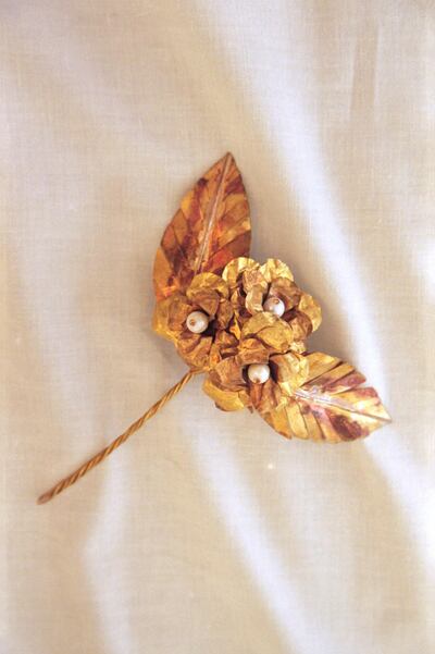 Handmade by artisans in Lebanon, each brooch is created from brass and pearl beads. Courtesy Krikor Jabotian