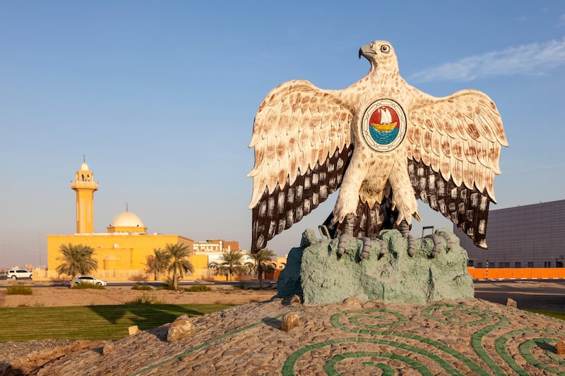 The UAE emblem is the inspiration for a falcon monument at a roundabout in Madinat Zayed, Abu Dhabi. Alamy