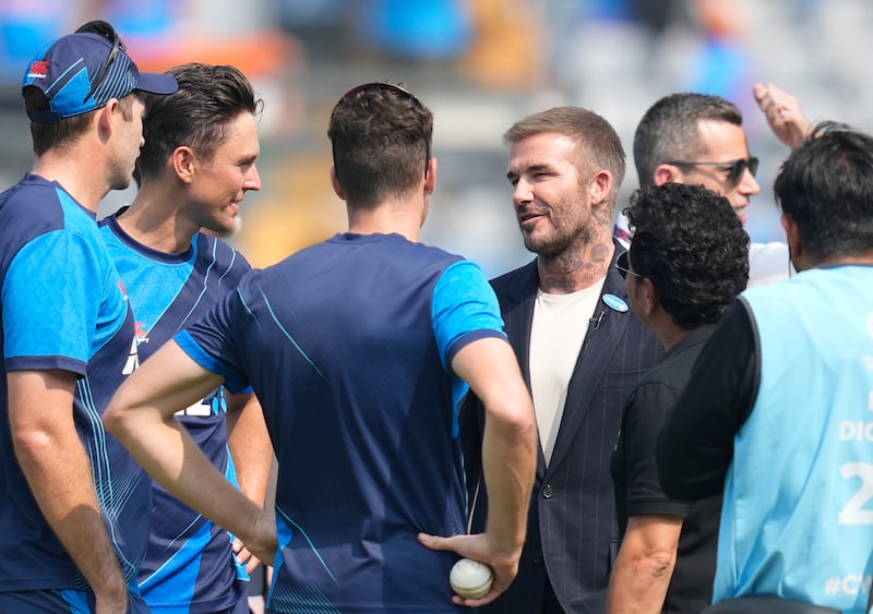 David Beckham and Sachin Tendulkar with New Zealand players in Mumbai. AP