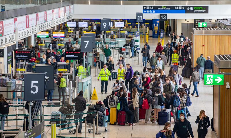 Passengers arrive at Dublin Airport on Friday morning as about 200,000 people were set to travel through its doors at the weekend. PA
