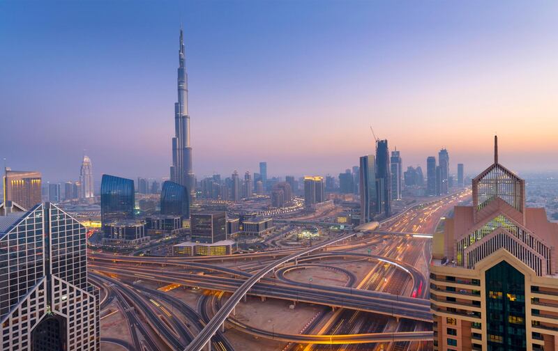 Dubai sky line with traffic junction and Burj Khalifa. Getty Images