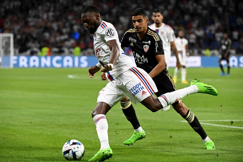 Lyon's Cameroonian forward Karl Toko Ekambi fights for the ball with Ajaccio's French forward Mounaim El Idrissy. AFP