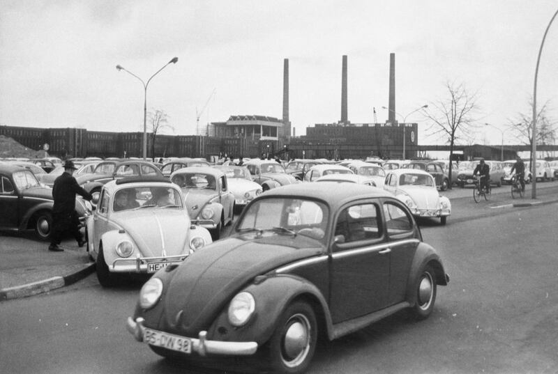 Workers drive their Beetles from the car park on their way home at the end of a days work at the world's largest single automotive plant, the Volkswagen factory in Wolfsburg, Germany, in 1966. AP Photo
