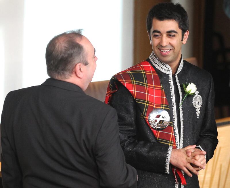 Alex Salmond, SNP leader at the time, with Mr Yousaf at the Scottish Parliament in 2011. Getty Images