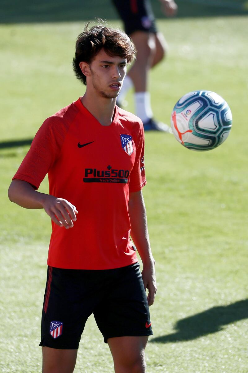 Joao Felix keeps an eye on the ball during training.