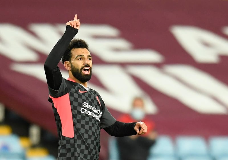 Soccer Football - Premier League - Aston Villa v Liverpool - Villa Park, Birmingham, Britain - October 4, 2020. Liverpool's Mohamed Salah celebrates scoring their first goal. Pool via REUTERS/Peter Powell EDITORIAL USE ONLY. No use with unauthorized audio, video, data, fixture lists, club/league logos or 'live' services. Online in-match use limited to 75 images, no video emulation. No use in betting, games or single club /league/player publications.  Please contact your account representative for further details.
