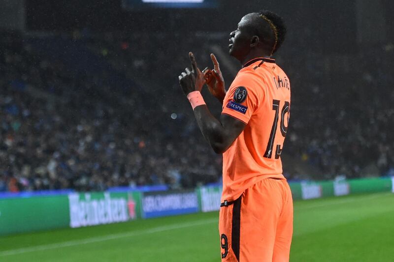 Liverpool's Senegalese midfielder Sadio Mane celebrates after scoring their third goal during the UEFA Champions League round of sixteen first leg football match between FC Porto and Liverpool at the Dragao stadium in Porto, Portugal on February 14, 2018.
Liverpool won the game 5-0. / AFP PHOTO / Francisco LEONG
