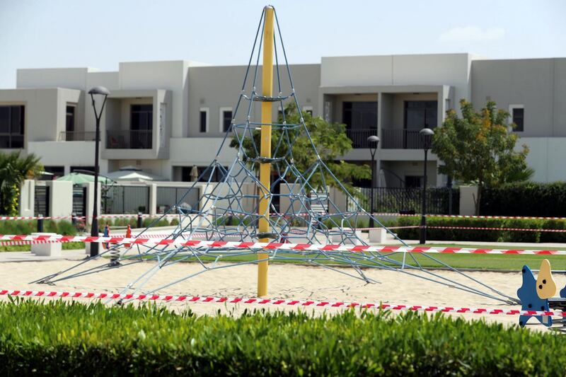 Dubai, United Arab Emirates - Reporter: N/A: A park is closed off with red and white tape. Tuesday, March 17th, 2020. Town Square, Dubai. Chris Whiteoak / The National