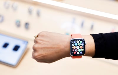 A saleswoman shows an Apple Watch in New York. EPA
