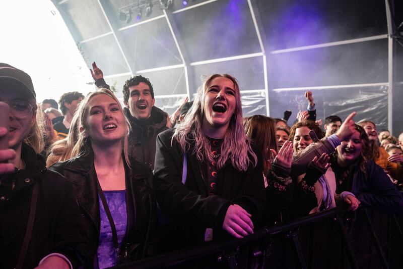 Music fans at a pop festival enjoy the event in Biddinghuizen, the Netherlands. The festival is part of a series of trial events in which researchers of the Fieldlab programme are investigating how large public events can take place safely during the pandemic. EPA