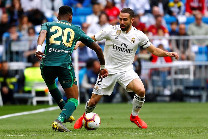 Real Madrid's Dani Carvajal in action with Real Betis' Junior Firpo. Reuters