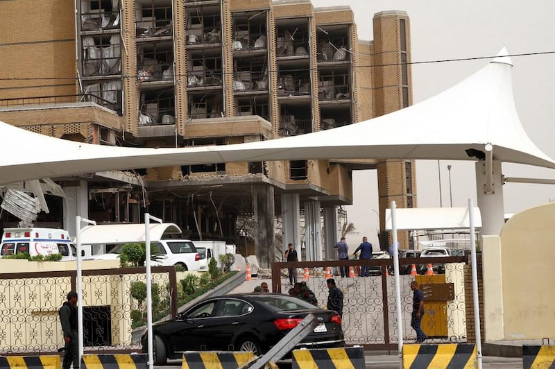 Iraqi policemen stand guard in the entrance of Babylon hotel. Ali Abbas / EPA