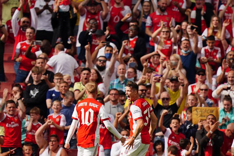 Arsenal's Granit Xhaka, right, celebrates with Emile Smith Rowe after scoring a goal in a 2-1 defeat to Chelsea.